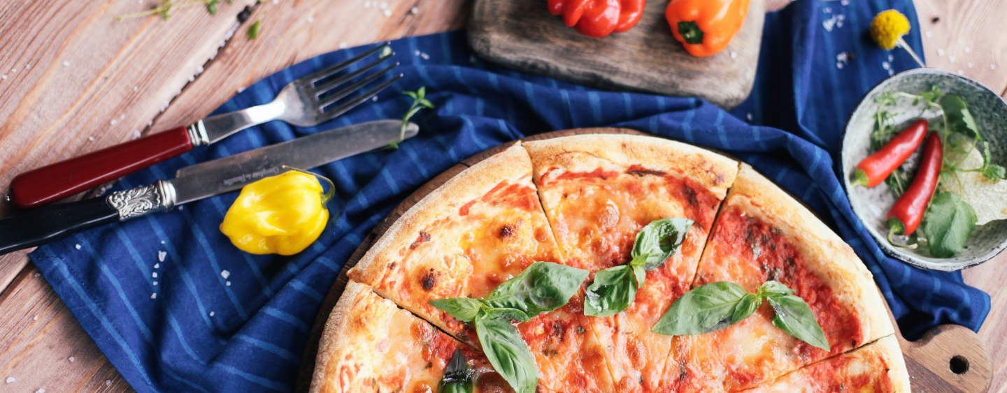 Pizza on plate with utensils